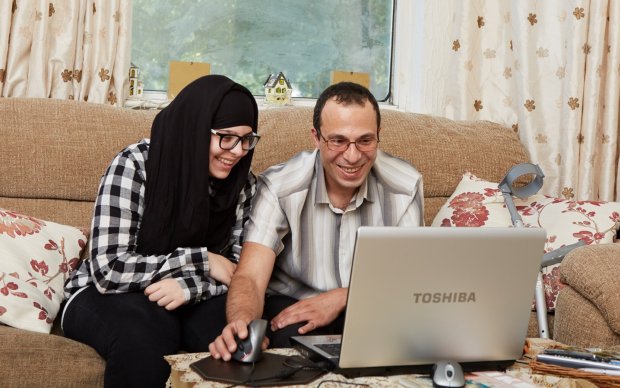 Couple at home on laptop