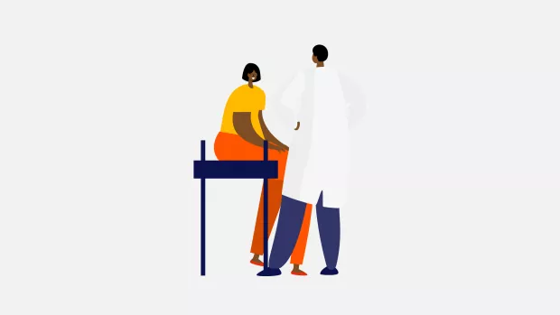 A doctor, standing, talking to a patient, sitting