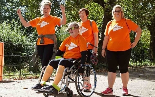 Photo: 4 women in MS T shirts on a fundraising walk 