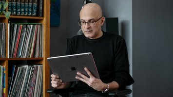 A man looking at his iPad