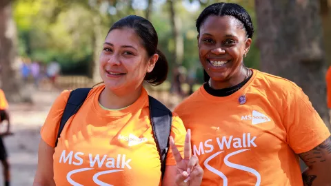 Two MS Society supporters wearing MS Walk t-shirts