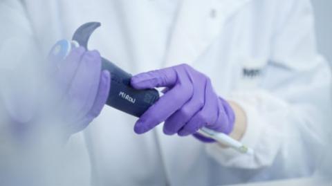 Researcher Pipette in hands